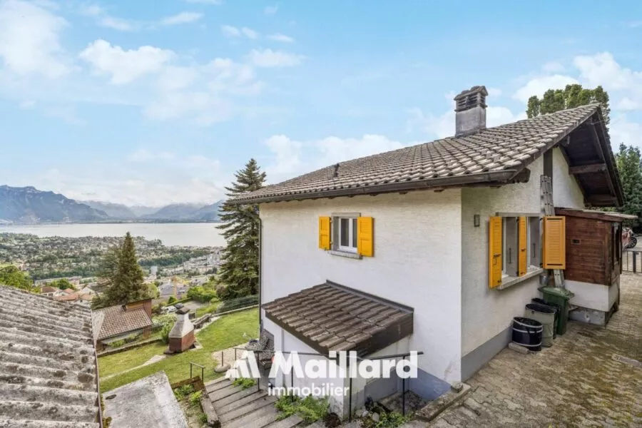 Maison individuelle avec vue dégagée sur le lac et les montagnes